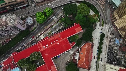 An aerial view of a city with a red roof