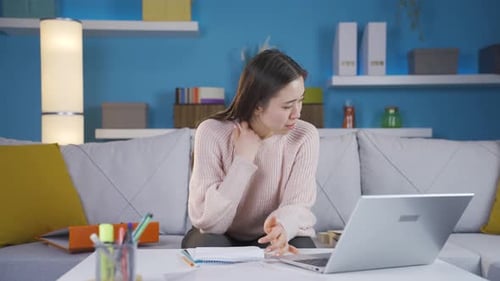 Asian Young Woman Bored and Depressed by Work at Home Office.