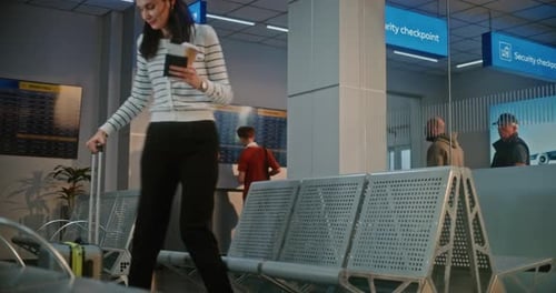 Airport Terminal Happy Woman with Suitcase Sitting in Boarding Lounge After Security Check