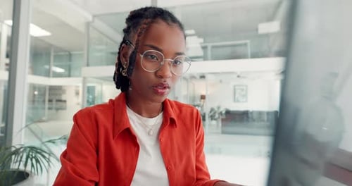 Woman Working at Computer in Modern Office