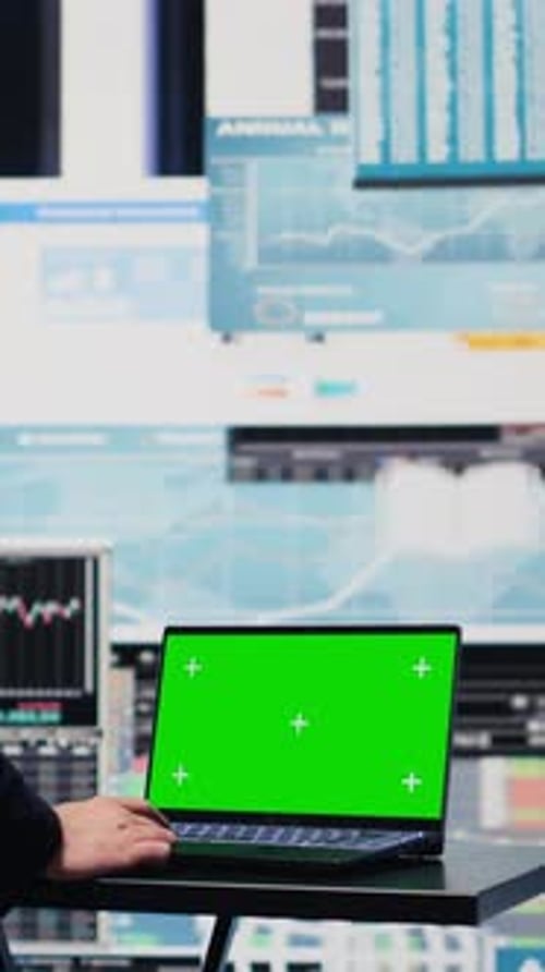 Vertical Video General Director with a Chroma Key Display Reviewing Performance Metrics