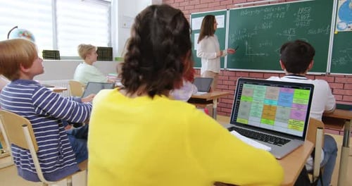 Teacher Instructing Students in a Classroom