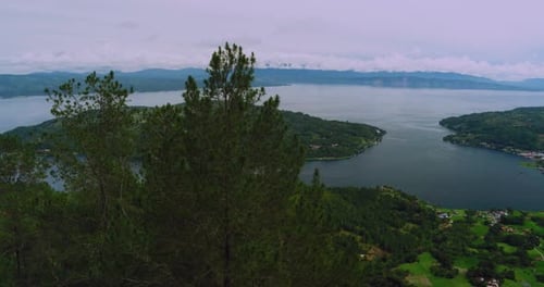 Aerial Drone Lake Toba Island View Surrounded by Hills Tropical Landscape