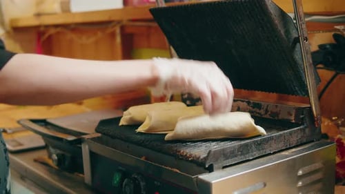 Close Up of Chef Cooking Burrito Eating Traditional Mexican Food Tex Mex Cuisine Hands Taking Cooked