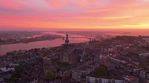 Aerial view of Nijmegen cityscape at sunrise, Netherlands.
