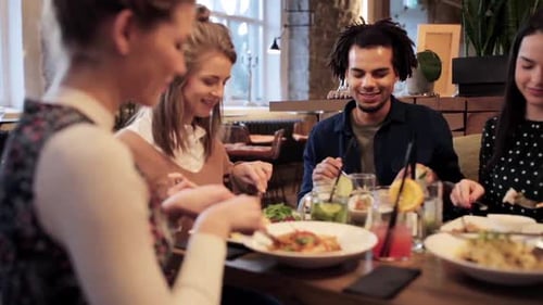 Friends Enjoying Lunch at a Restaurant Together