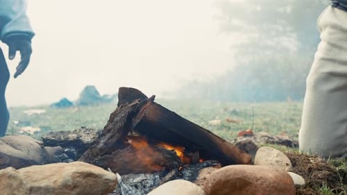 Fire, camping and nature with wood burning in the morning closeup for warmth