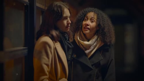 Friends Chatting on a City Street at Night