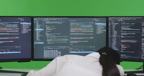 Tired Woman Developer Yawning Before Sleeping While Write Code With Multiple Screens In Green Screen