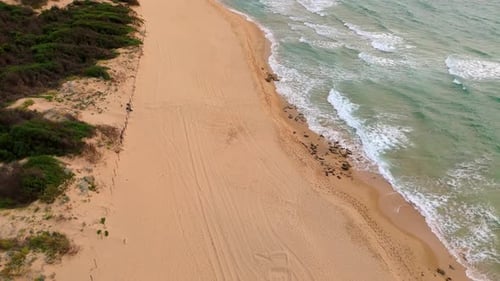 The Beach Displays a Serene Landscape with Golden Sands Calming Waves Italy