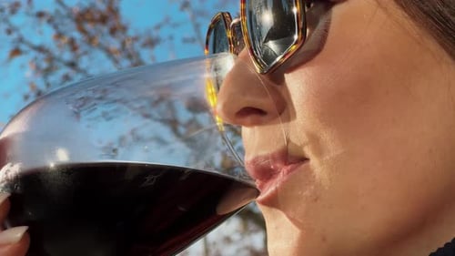 Woman Tasting Red Wine Enjoying Summer Stay on Lovely Sunny Day Wine Degustation