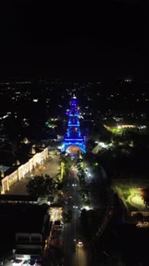 Vertical drone footage of Limboto Majesty Tower or Pakaya Tower at night