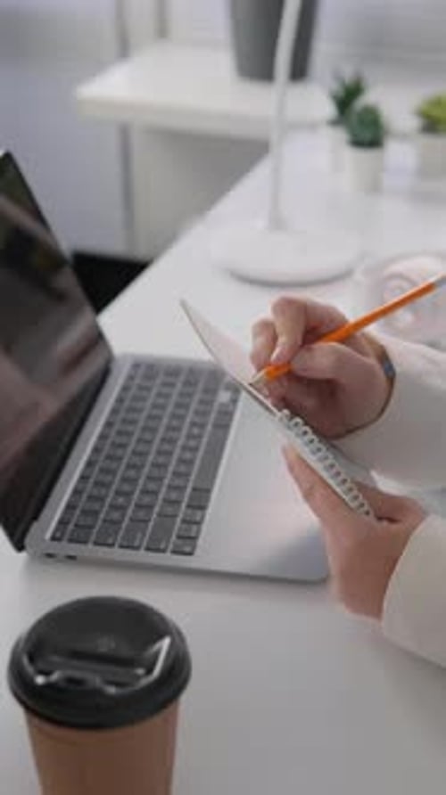 In This Video a Student Writes a Report on Her Laptop on Her Home Desktop She Carefully Analyzes