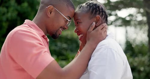 Affectionate Couple Smiling Face to Face Outdoors