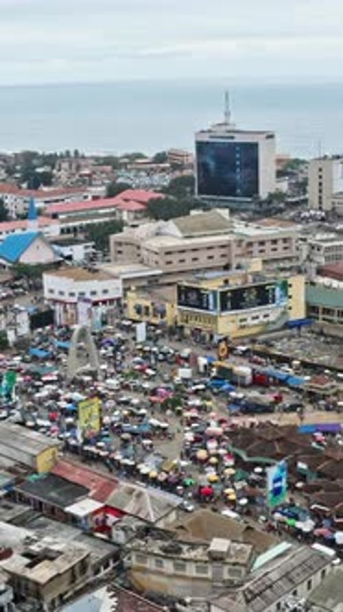 Crowd of people and cars at Accra Central Market