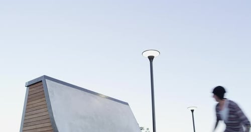 Skatepark, fitness and man with ramp stunt outdoor with freedom, skill or balance on blue sky