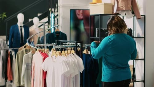 Woman Shopping for Clothes in a Retail Store