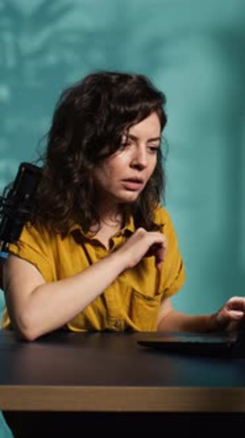 Vertical Video Woman Chatting with Subscribers Presenting Information on Notebook Device