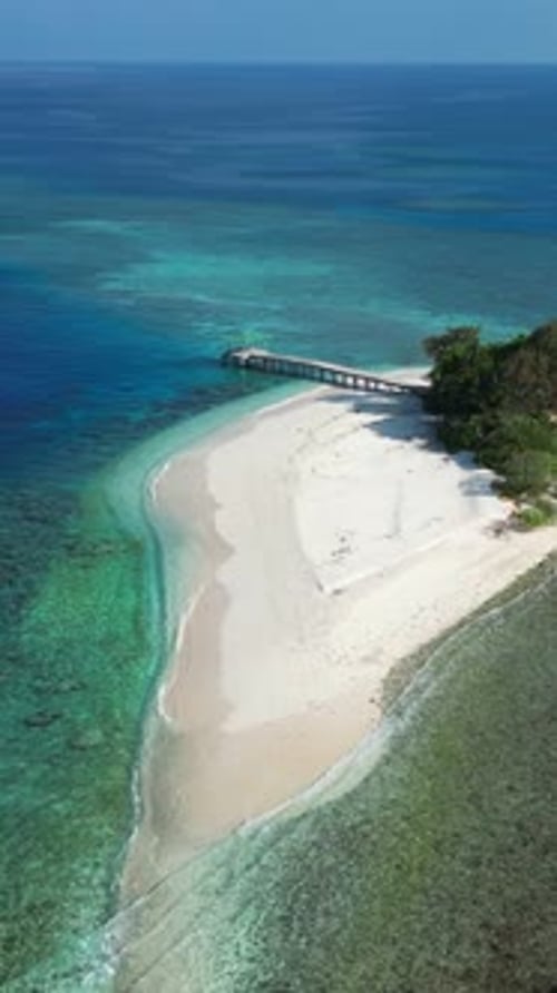 Small Tropical Island in Blue Sea Drone Point of View