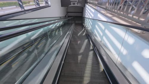 Empty Moving Walkway in Shopping Mall Leading to Supermarket Modern Escalator Travelator with Glass