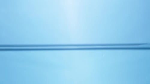 Gentle Waves Rippling Across Clear Blue Water