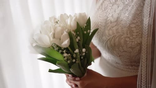 Bride Holding Bouquet of White Tulips Close Up