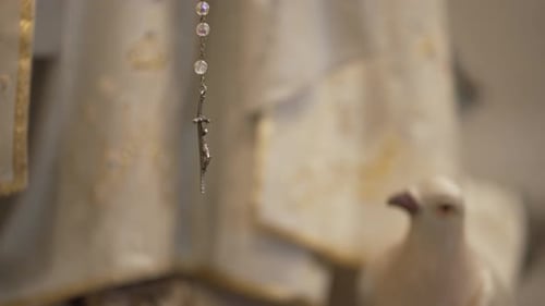 Silver Cross Hanging with White Dove Statue
