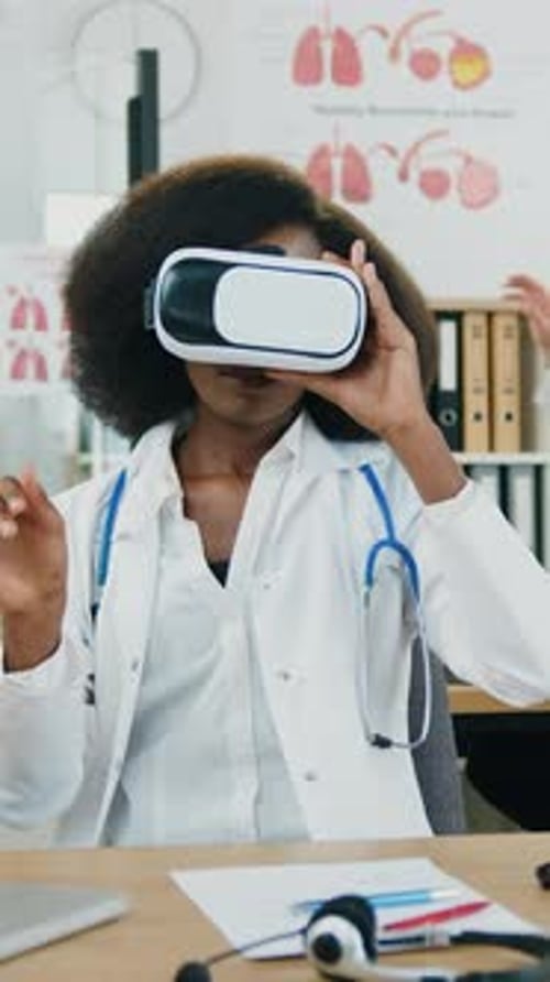 Woman Doctor Using Virtual Reality Headset in Office