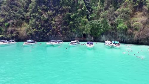 Aerial view of iconic tropical turquoise water Pileh Lagoon surrounded by limestone cliffs, Phi Phi