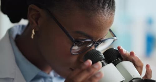 Focused Adult Working in Modern Medical Research Lab