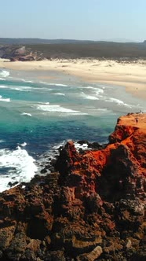 Vast Sandy Beach with Ocean Waves Scenic Aerial View of Vibrant Coastlines and Rolling Waves