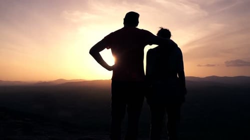Silhouette Of Couple Admire Sunset And Landscape Standing On Hill, Super Slow Motion 240fps