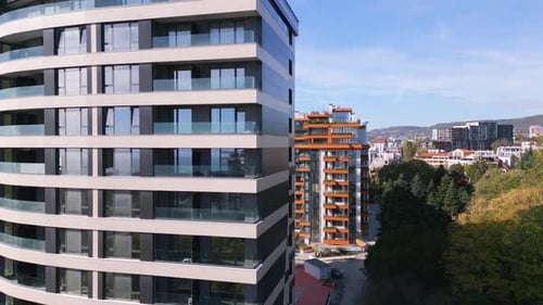 Drone Flight Along the Facade of a Modern Office or Residential Building Background