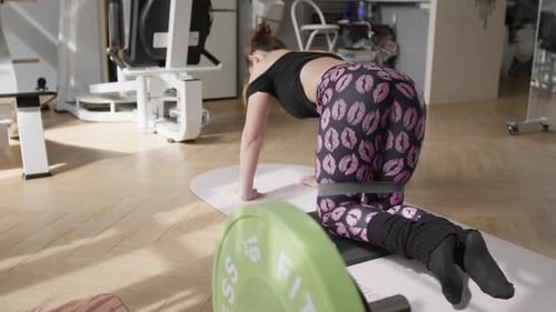 Focused home gym workout with resistance bands and modern fitness equipment