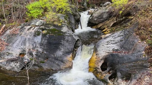 Water pools at the base of a stream