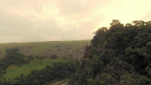 Drone of Young Free Climber and Hiker, Climbing Mountain Cliff