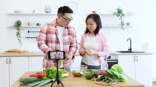 Couple Filming Cooking Vlog