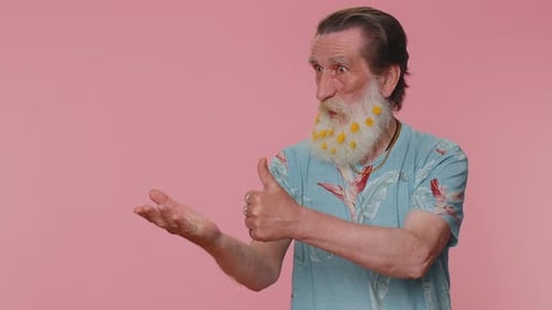 Senior Man Pointing Empty Place Advertising Area for Commercial Text Copy Space for Goods Promotion