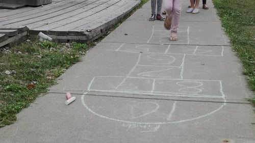 Girl Playing Hopscotch on Sidewalk 89 Years
