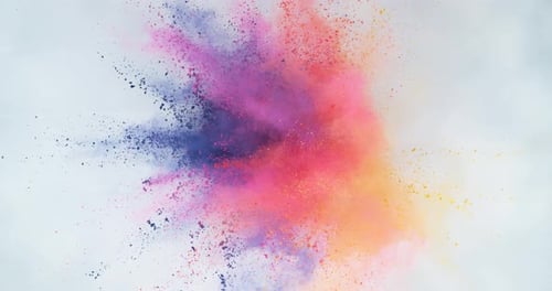 Colorful powder explosion on white background in slow motion