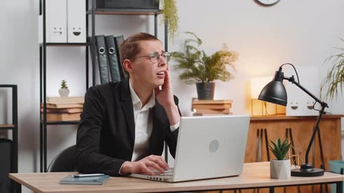 Shocked Businessman Using Laptop Working Loses Becoming Surprised Bad News Loss Game Fail at Desk