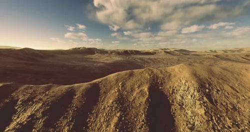 Majestic Desert Landscape with Rolling Hills and Dramatic Skies at Sunset