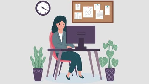 Businesswoman Working in Office in Front of Her Computer