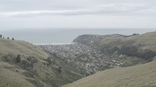 Passarela à beira-mar, erro de Taylor, Nova Zelândia, vista aérea da praia Taylor's Mistake a partir de Godley