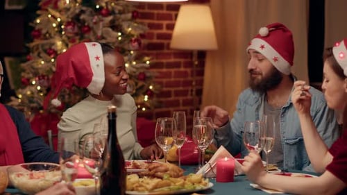 Friends Toasting Champagne at Christmas Dinner Party