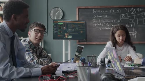 Students Learning Computer Science in a Bright Classroom