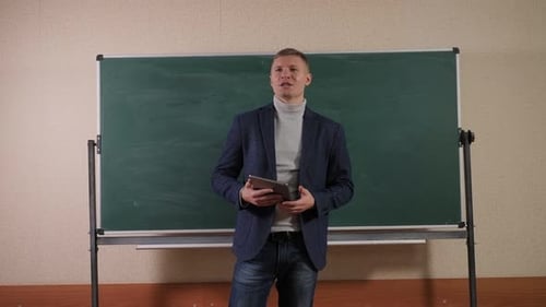 A Young Male Professor of Mathematics in the Lecture Hall He Reads a Lecture