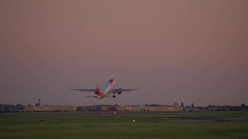 Airplane Taking Off at Sunset