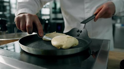 Chef Cooking Delicious Pancakes in Commercial Kitchen