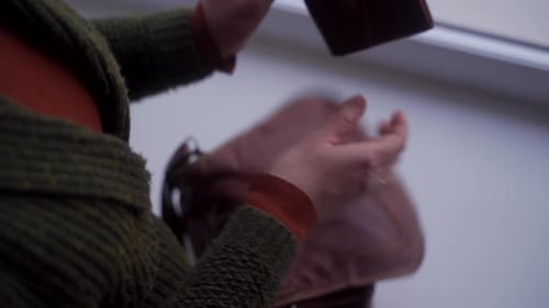 Woman Takes Money from Wallet Inside Bag